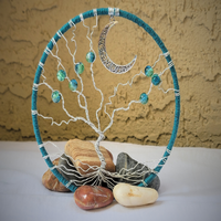 front view showing vignette background letting beautiful blue color hoop stand out standing amongst tumbled stones crescent moon accent  front view showing vignette background letting beautiful blue color hoop stand out standing amongst tumbled stones crescent moon accent